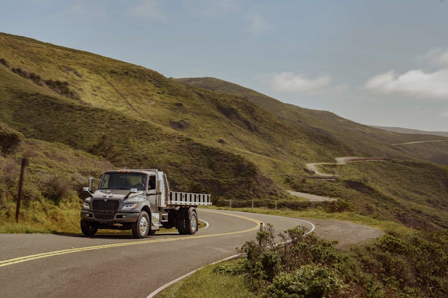 A truck driving on a winding road