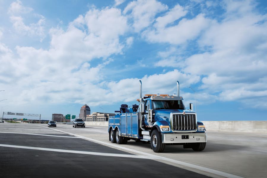 A blue truck on a road