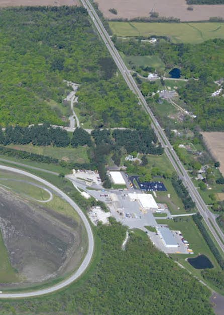An aerial view of a road and a forest