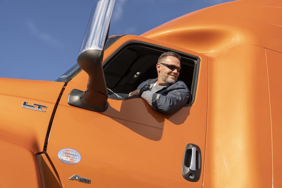 Man in orange LT Series truck