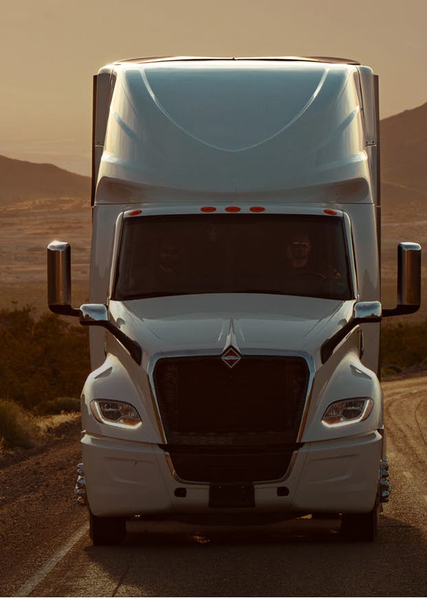 A truck with mountains in the background