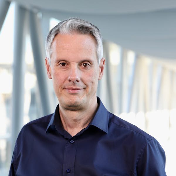 A person wearing a navy colored shirt