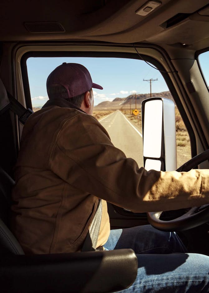 A person driving a truck
