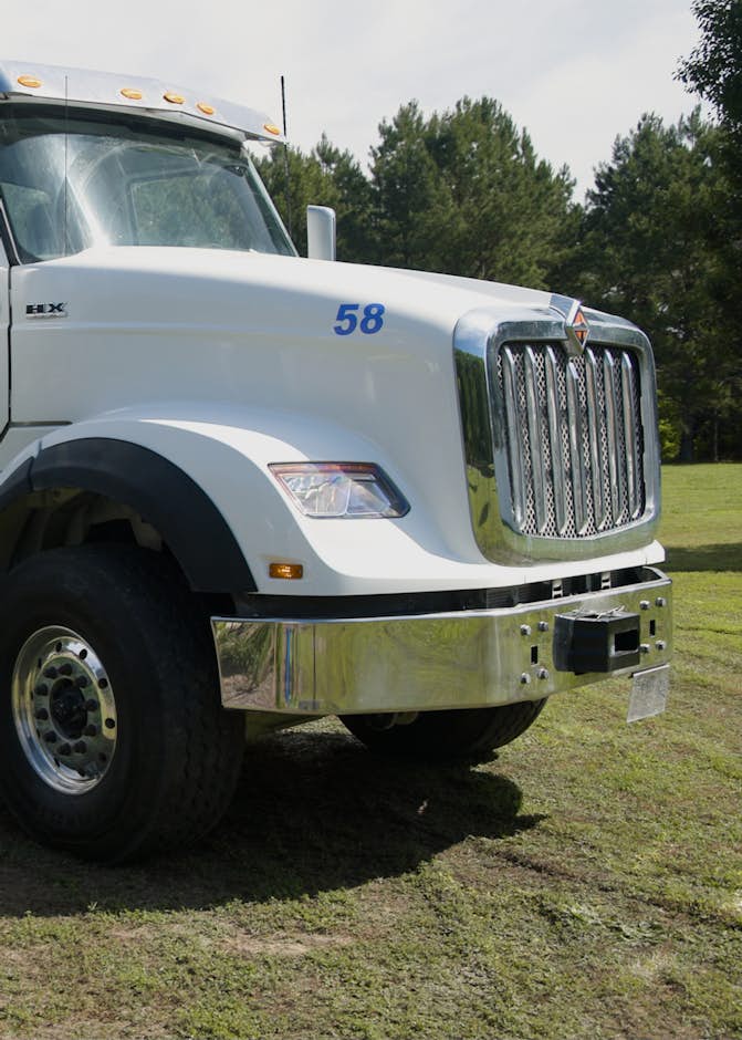International concrete truck parked in grass