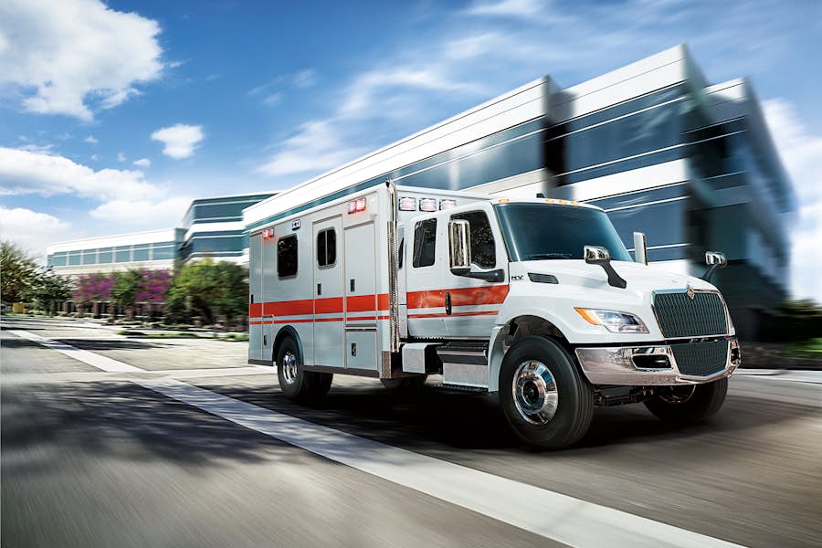 MV Series ambulance on road in front of hospital
