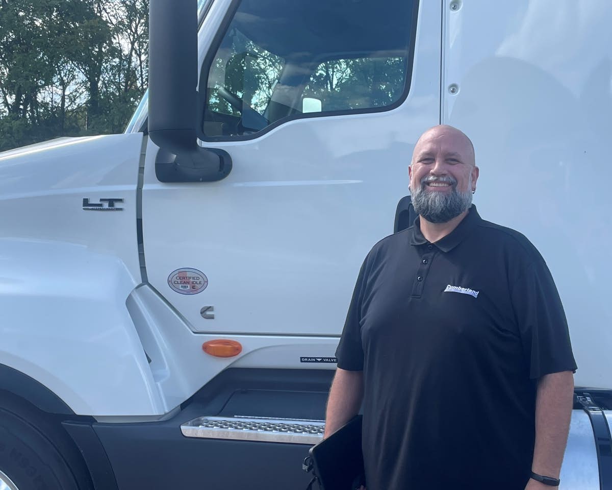 International dealer service advisor in front of truck
