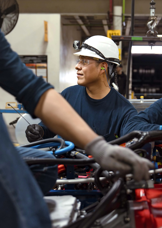 A group of men working on a machine